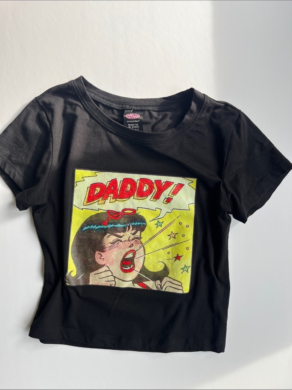 Cherry Kitten Archie Comic “Daddy!” Cropped Tee in Black.